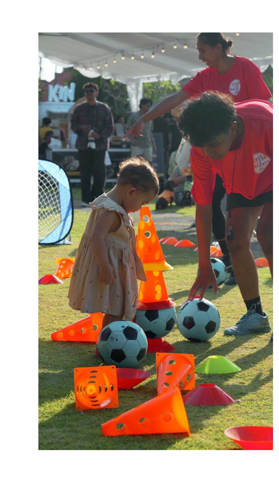 Child playing football games on the lawn