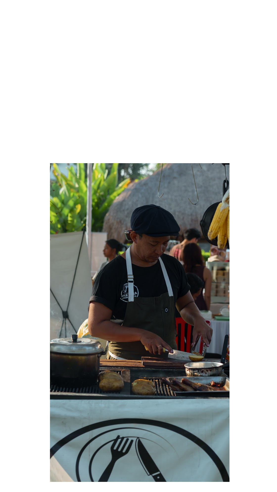 Market chef preparing food at the grill