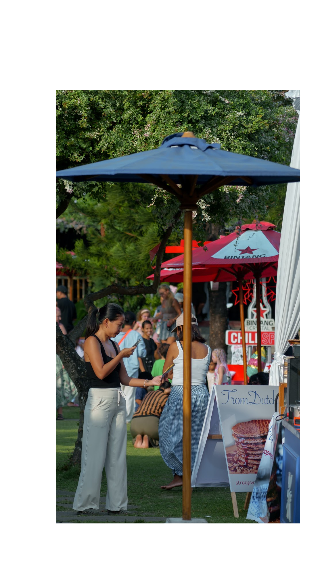 Guests gathering around an outdoor food stall